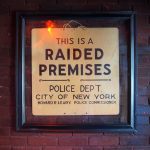The "raided premises" sign just inside the door at the Stonewall Inn, a gay bar on Christopher Street in Manhattan's Greenwich Village.