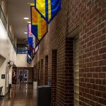 Flags hang in a hallway in the L. J. Goins building at Pellissippi's Hardin Valley campus. | Sophie Perrins