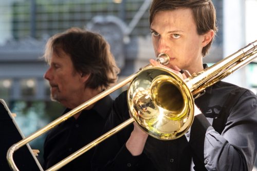 A man plays the trombone.