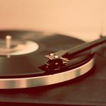 A vinyl record on a record player.