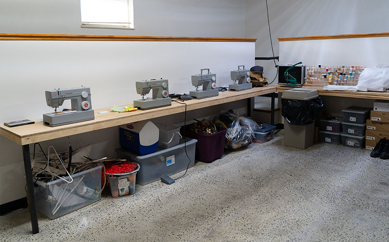 A view of a row of Singer sewing machines in the workshop of the Hardin Valley House.