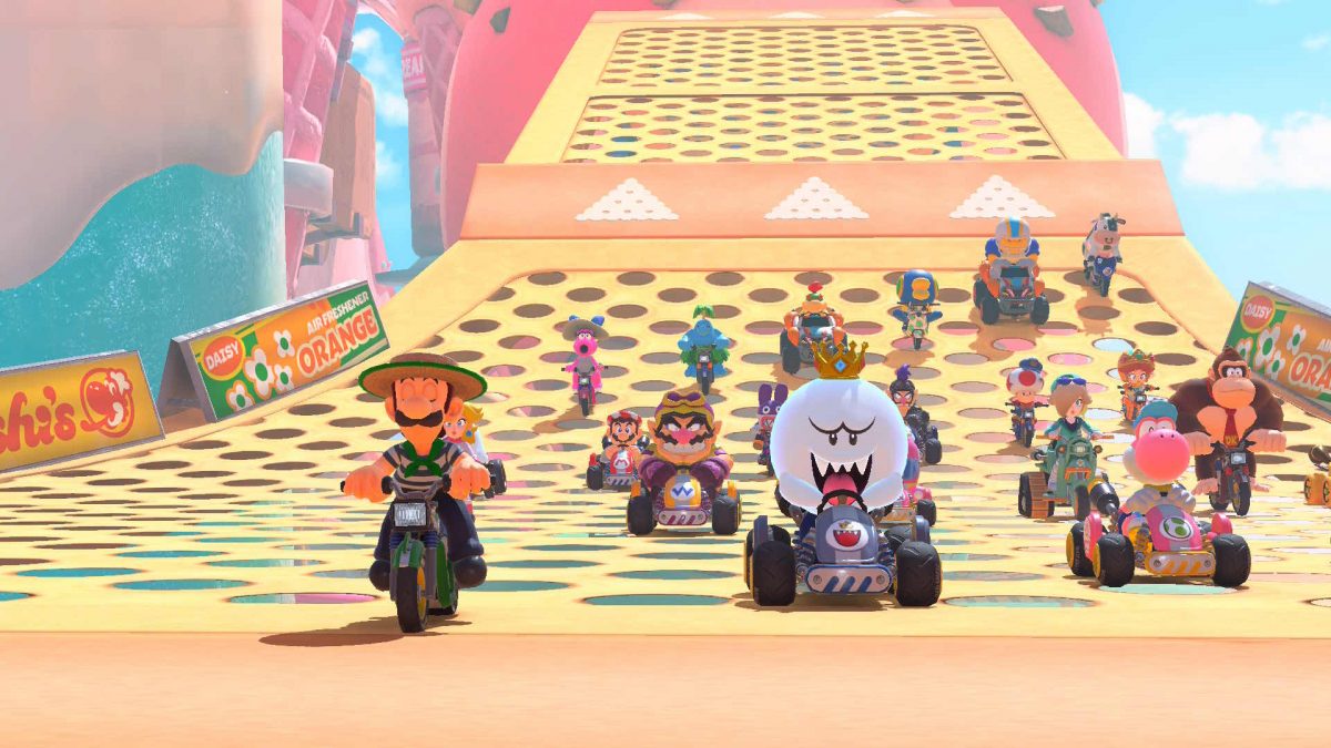 Mario Kart characters lined up on a race track before the race begins