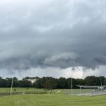 Dark storm clouds fill the sky.
