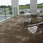 tables and chairs on the balcony area of Haslem