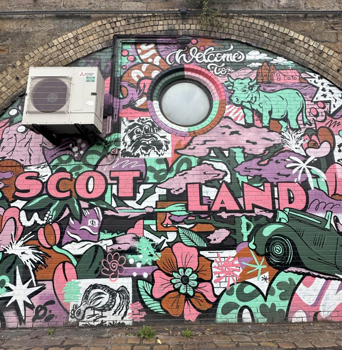 Street art that says "Welcome to Scotland"