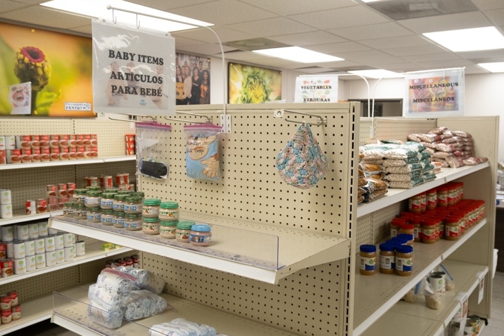Baby supplies, dry beans and soups are on shelves.