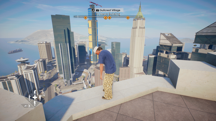 A skater prepares to do a trick on top of a building.