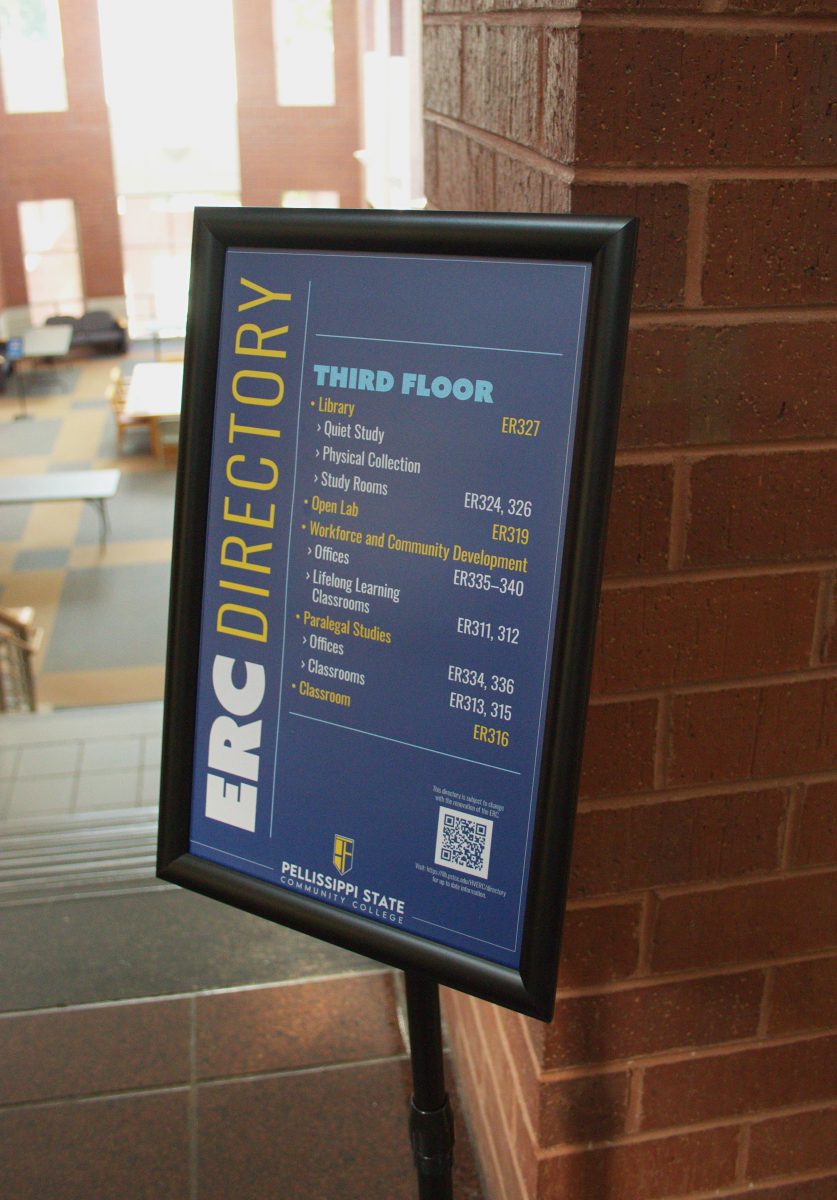 A framed sign attached to a stand with directions for the ERC.