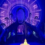 Laufey in a spotlight at a contest.