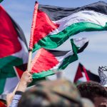 Palestinian flags flying in the wind.
