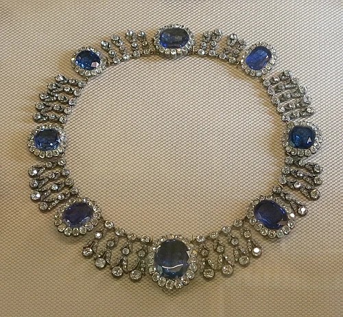 A necklace with sapphire gemstones.
