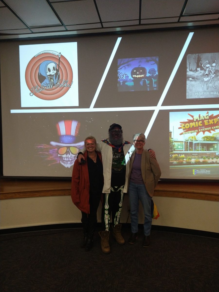 Professor Jeepers, or Grant Mincy with fellow professors posing in front of presentation