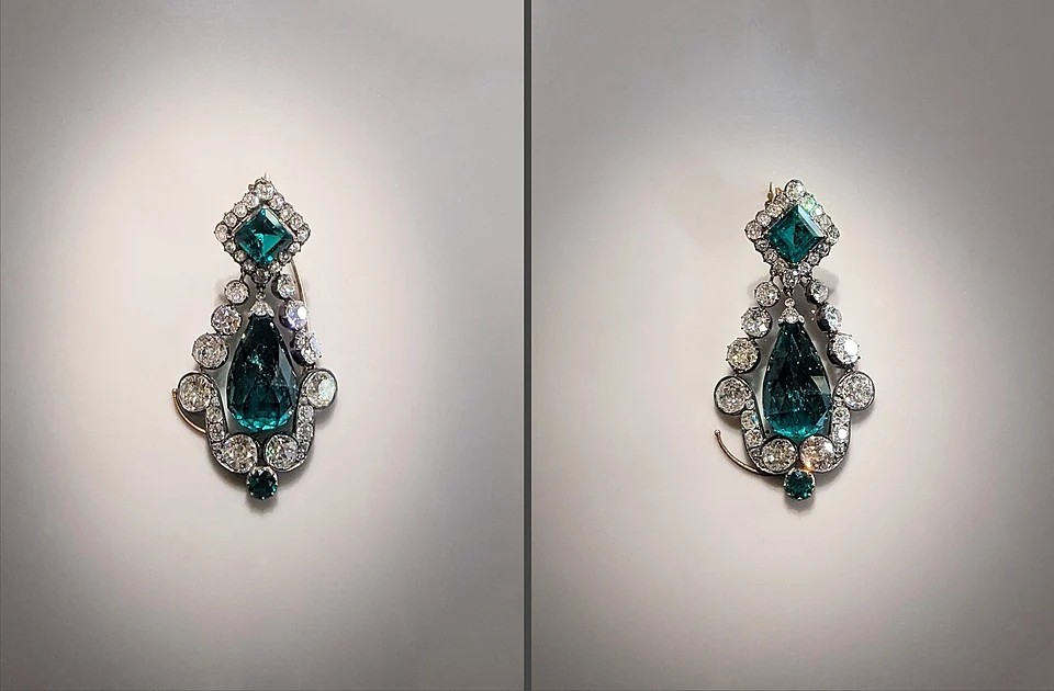 Two emerald earrings.