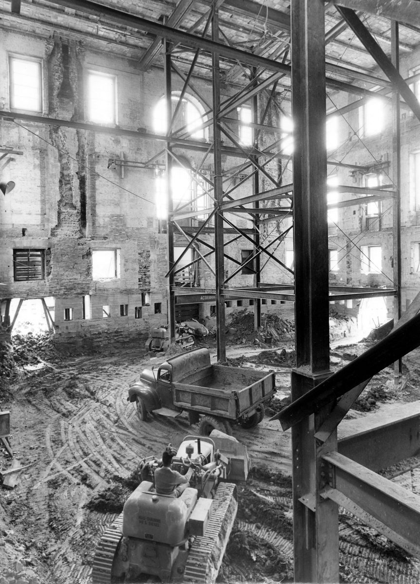 A photograph of the gutted interior surrounded by the still standing exterior walls of the White House