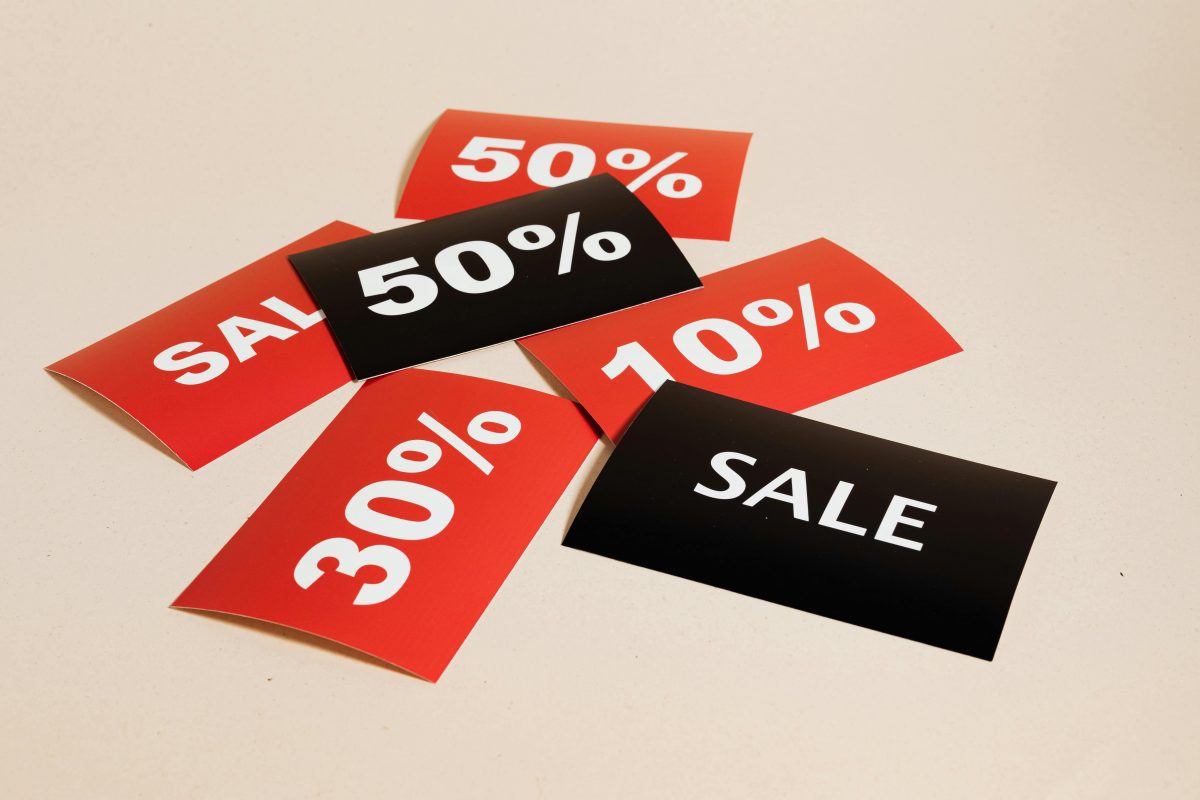 Black and red sales tags in a pile