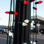 Christmas lights around a light pole.