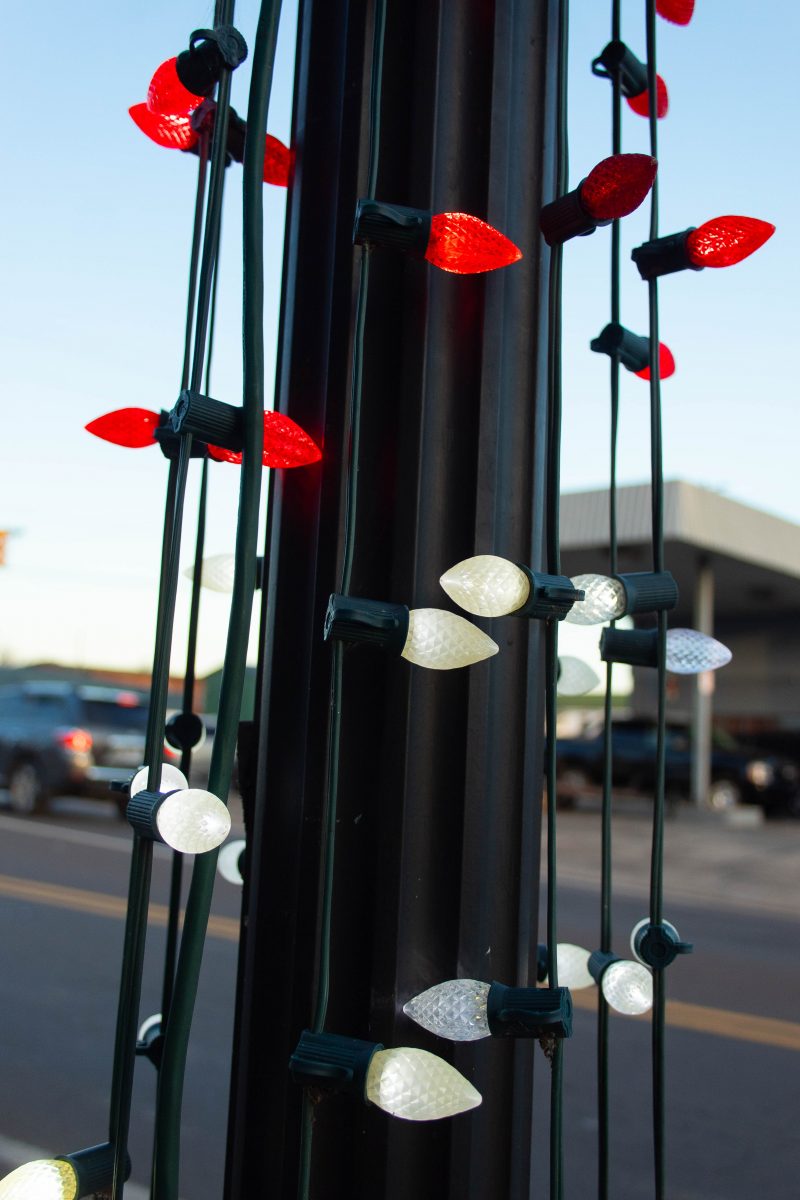 Christmas lights around a light pole.