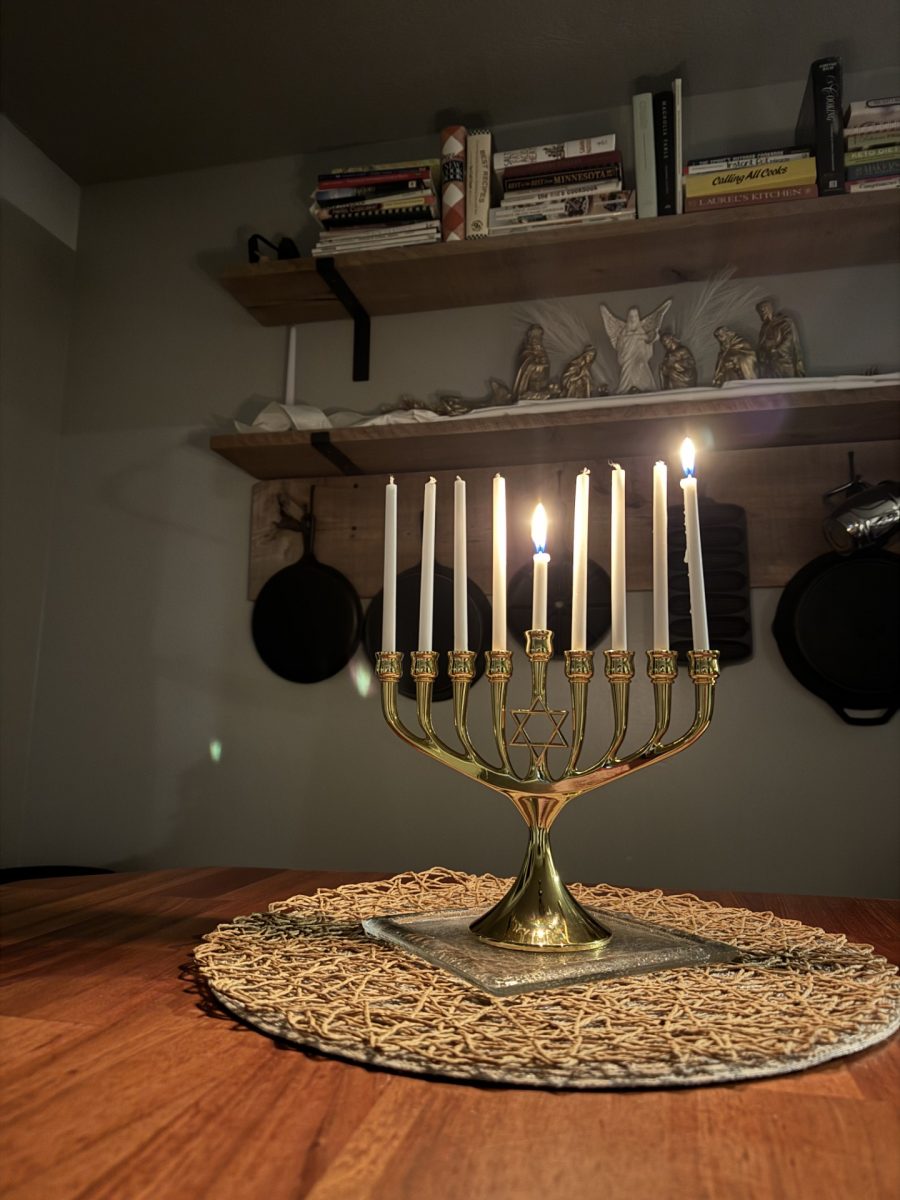 A Hanukkah menorah with two of its nine candles lit.