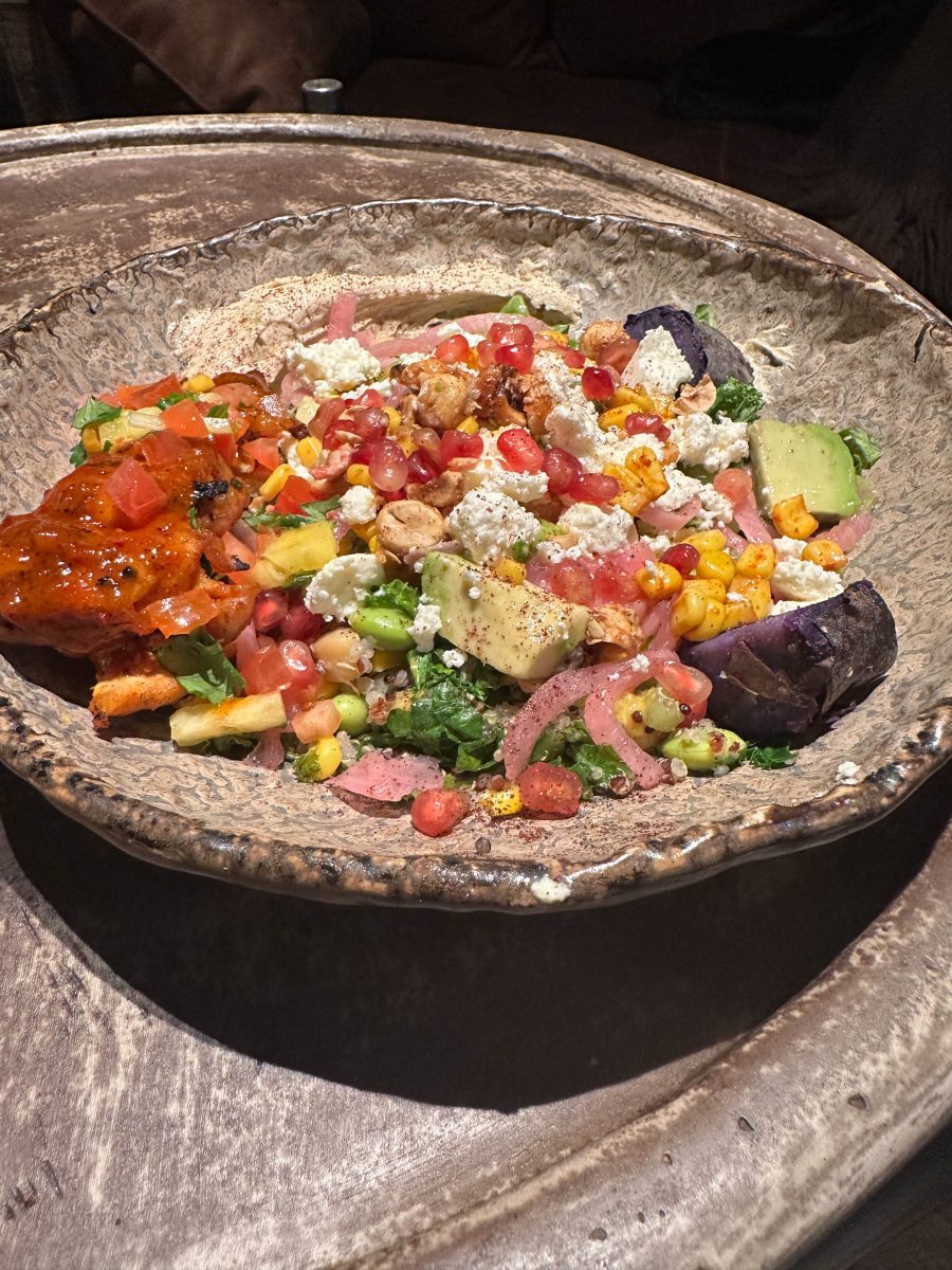 A colorful Mediterranean-style bowl of food