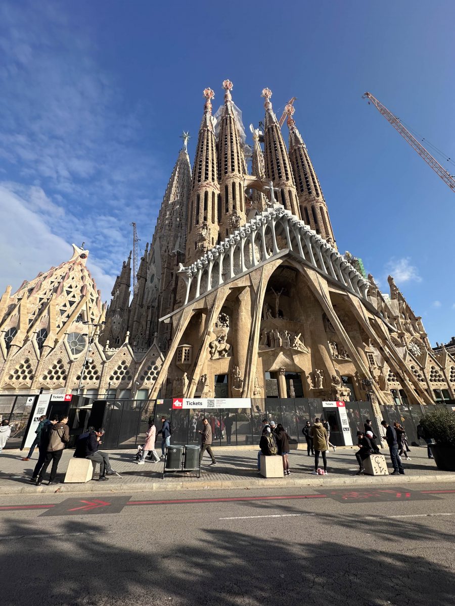 A tall, stone building with many arches and points
