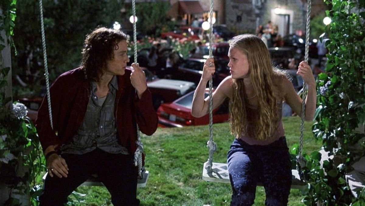 Kat and Patrick on a swingset.