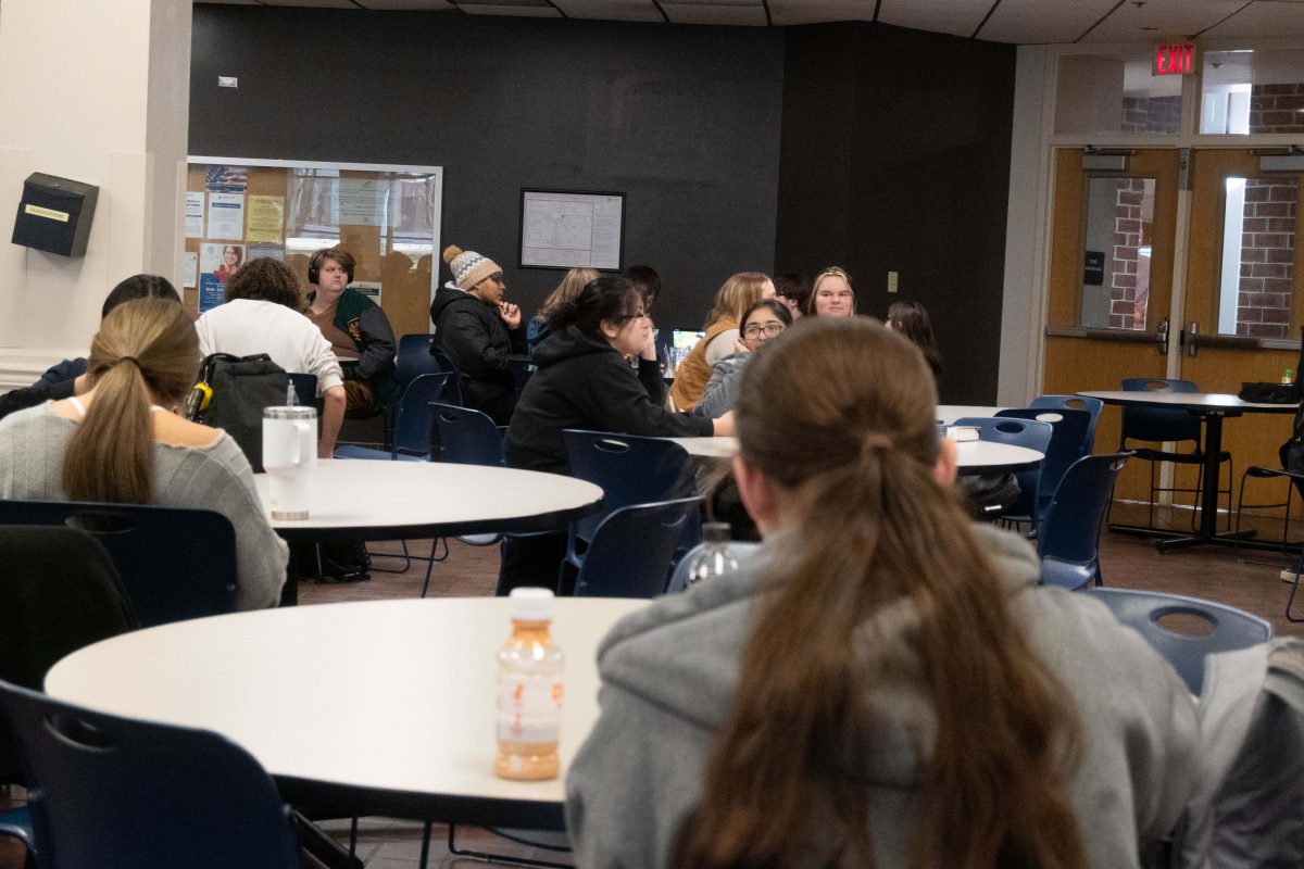 Students sitting in a cafeteria.