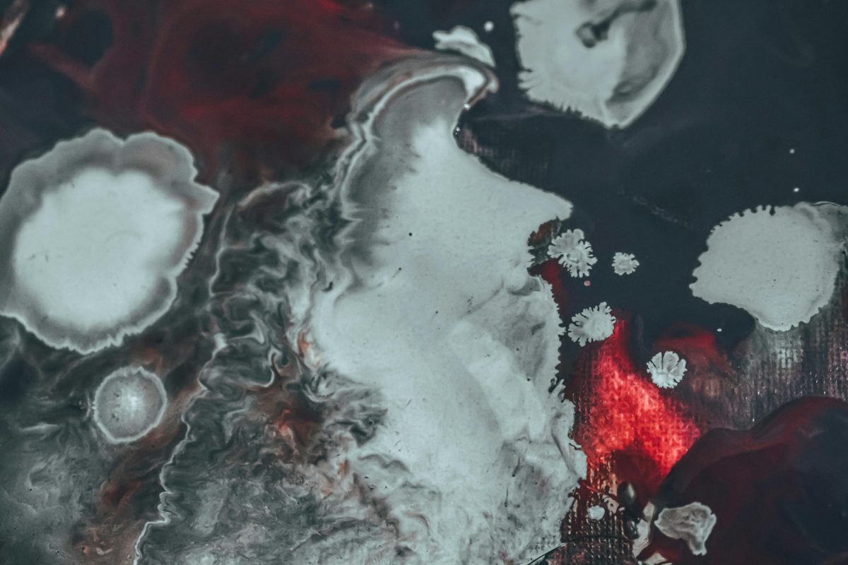 Black and red paint against canvas