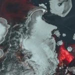 Black and red paint against canvas