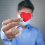 A Man Holding a Heart
