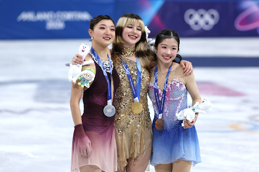 Alysa Liu, Kaori Sakamoto, and Ami Nakai posing with their 1st, 2nd, and 3rd place medals