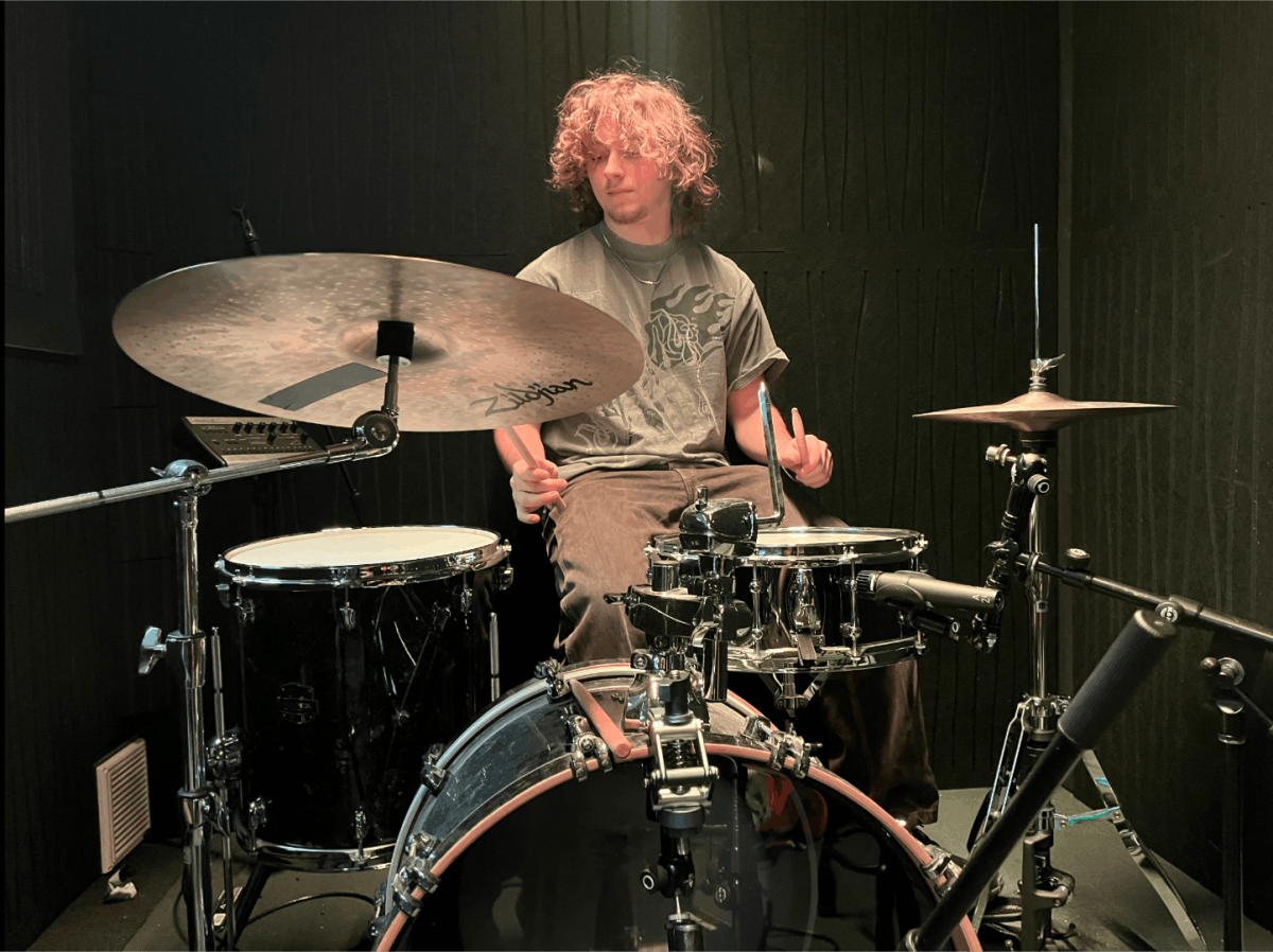 Lyons playing the drums