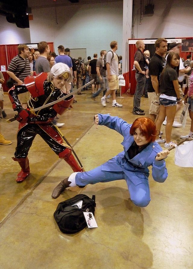 Two cosplayers posing for a photo.