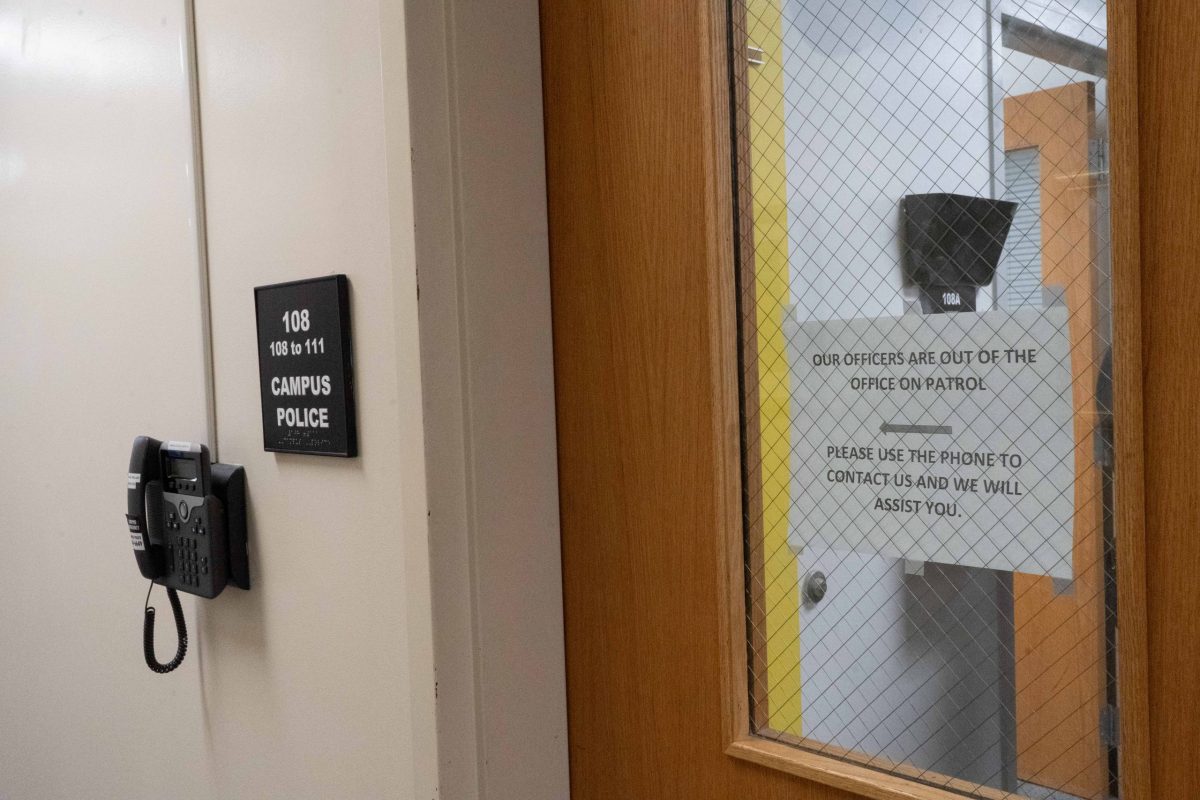 108 room number, Campus police. Sign that reads "Our officers are out of the office on patrol" 'Please use the phone to contact us and we will assist you."
